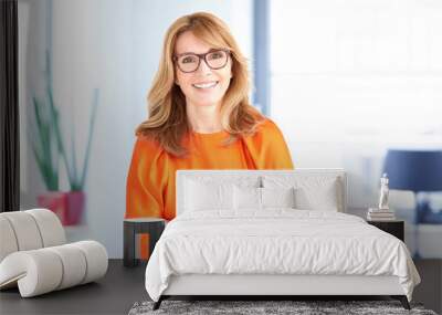 Portrait of middle professional woman with toothy smile standing in the office Wall mural