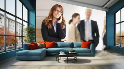 smiling professional businesswoman on the phone Wall mural