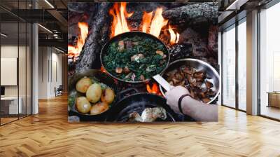 campfire red meat in pan, near the fire outdoors. bushcraft, adventure, tea, knife and camping concept. Wall mural