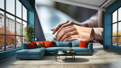 Humans hand typing on laptop keyboard. Blured morning background. Business concept image Wall mural