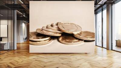 A close-up of a pile of shiny golden casino chips Wall mural