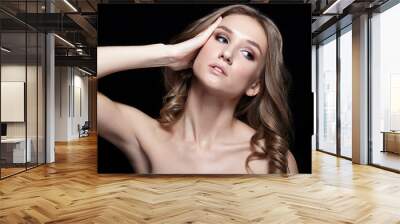 Female with wavy hair on black background Wall mural