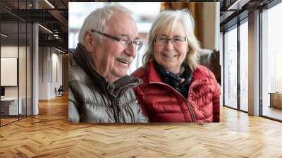 A man and woman sitting together smiling at the camera. AI. Wall mural