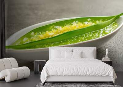 Green soup in a white bowl with a leaf on top. AI. Wall mural