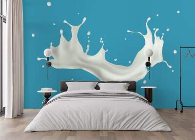 Milk splash isolated on blue background. Wall mural