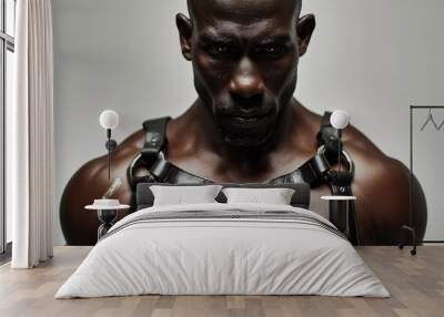 A detailed close-up of a rugged african-american man in a stylish black leather harness, posed against a minimalist white studio backdrop Wall mural