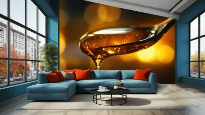  single droplet of honey slowly dripping off the edge of a spoon.  Wall mural