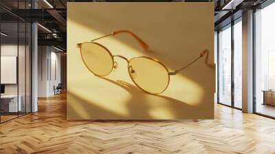 minimalist eyeglasses on a beige background, clean and modern, soft shadows Wall mural