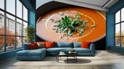 A bowl of soup with parsley on top Wall mural