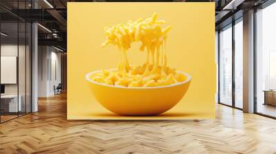 A bowl of yellow macaroni with melted cheese Wall mural