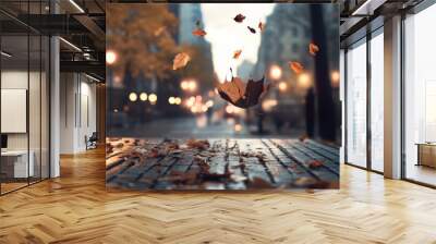 A leaf is floating in the air above a city street Wall mural