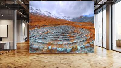 A magical place in the mountains. Ancient mazes of stones. Mountain landscape. Wall mural