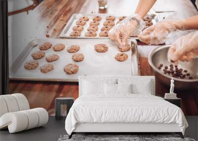 Girls bake oatmeal cookies at home Wall mural