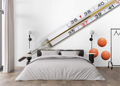 Medical thermometer shows a temperature of 38 degrees. Colds. Pills on a white background. Wall mural