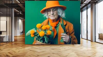 Portrait of funny old lady gardener with flower seedlings on orange green background. Generative AI. High quality illustration Wall mural