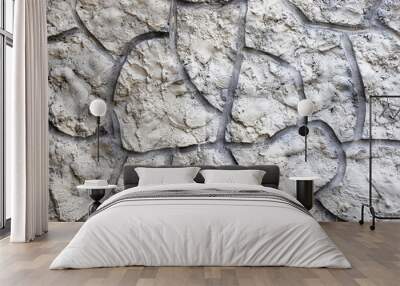 Gray textured plaster on the wall is embossed. The texture on the wall is a rough decor. Wall mural