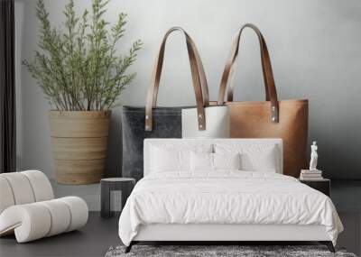 Two handbags, one black and one white, are displayed on a table Wall mural