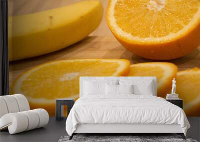 yellow juicy orange closeup on wooden table Wall mural