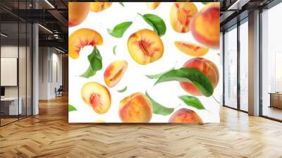 Juicy peaches falling with green leaves isolated on white. Defocused flying slices of peach Wall mural