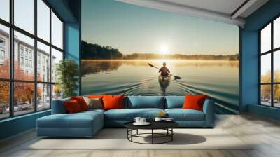 Tranquil lake scene with person kayaking on calm waters under the sun s reflection Wall mural