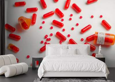 Addictive pain relief drug, oral administration therapeutic medicine and healing science concept with many spilling red prescription medication isolated on white background with copy-space isolated  Wall mural