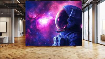 An astronaut in a space suit gazes at a vibrant galaxy with purple and pink hues, surrounded by stars and cosmic beauty. Wall mural