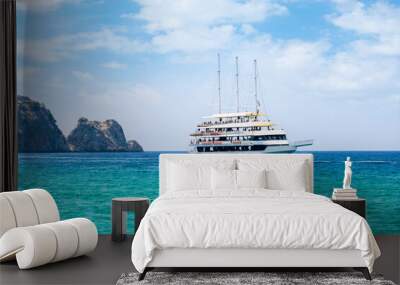 Beautiful view of white touristic ship in azzure water of the Mediterranean sea. Wall mural