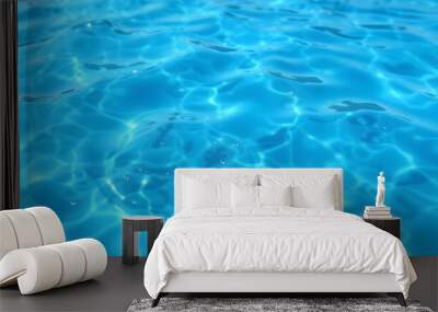 Blue water with ripples on the surface. Defocus blurred transparent blue colored clear calm water surface texture with splashes and bubbles. Water waves with shining pattern texture background isola Wall mural