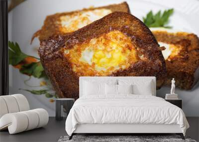 Eggs fried in bread, closeup Wall mural