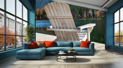 comfortable wooden sun lounger against the backdrop of colorful mountains with emerald lake. vertica Wall mural