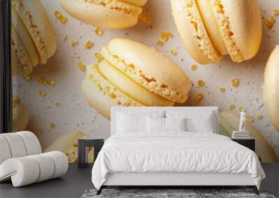 Delicious yellow macarons sprinkled with sugar on white background Wall mural