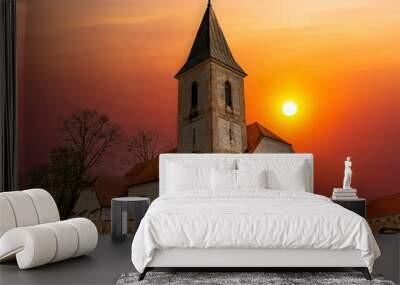 Rural church at sunset. Wall mural