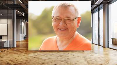 Mature man in glasses outdoor Wall mural