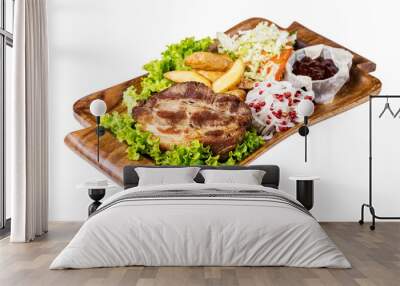 Gourmet meal of marinated pork  served with potatoes and sauce on wooden plate, isolated on white. Wall mural