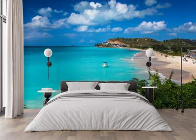 Tropical beach at Antigua island in Caribbean with white sand, turquoise ocean water and blue sky Wall mural