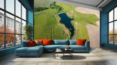 Lake among agricultural fields. Aerial drone view. Wall mural