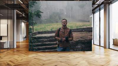 Man walking alone. Fortification on top of the mountain, old castle. Journey. Mystical atmosphere, fog, white haze, mist. Summer day. Second Tower. San Marino, Italy Wall mural