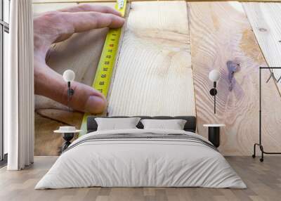 Measure with a tape measure on a wooden board Wall mural