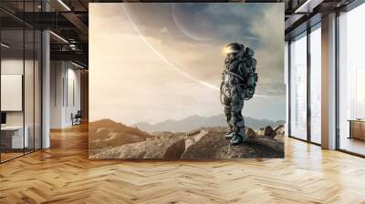 Astronaut walking on an unexplored planet . Mixed media Wall mural