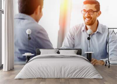 attractive office worker sitting at desk Wall mural