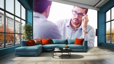 Attractive office worker sitting at desk Wall mural