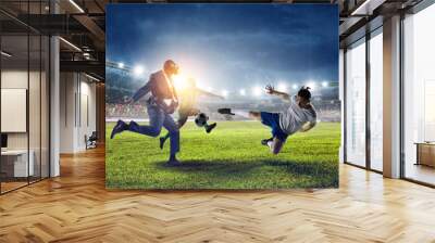 Black businessman on virtual reality football match Wall mural