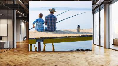 boy and his father fishing togethe Wall mural