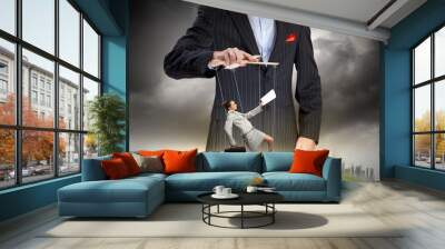 Businessman puppeteer Wall mural