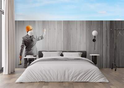 Businessman with hammer Wall mural