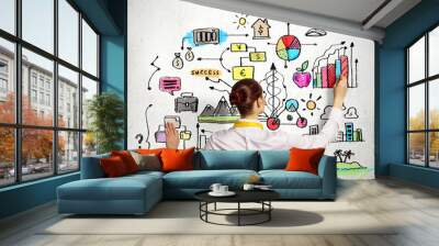 Businesswoman drawing on wall Wall mural