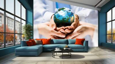 Earth planet in hands Wall mural