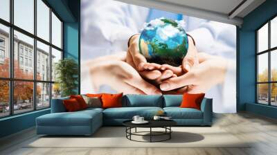 Earth planet in hands Wall mural