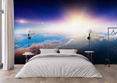 Earth with sunrise on blue space background Wall mural