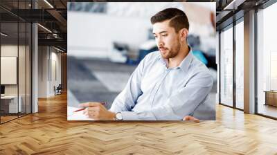 Handsome businessman in office Wall mural